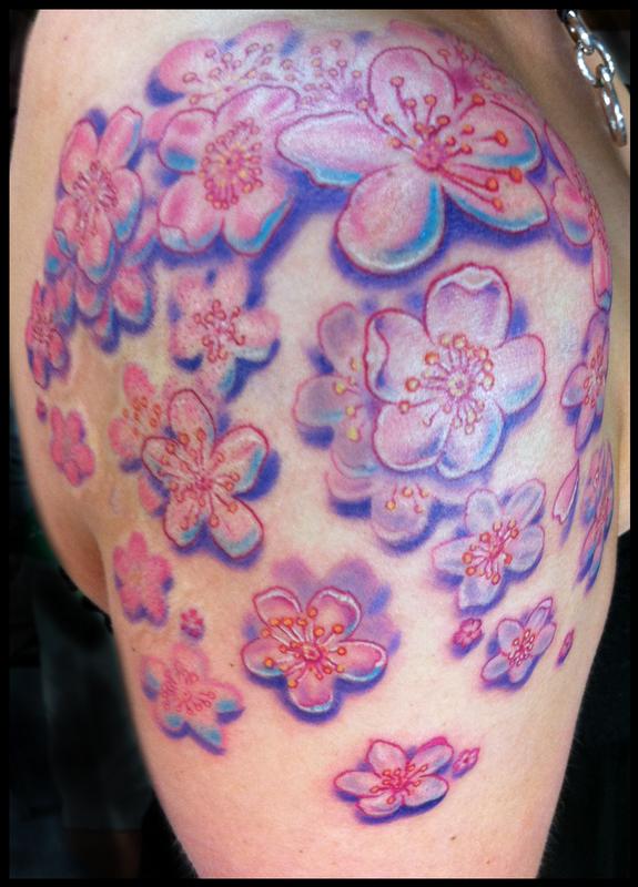 Cluster of cherry blossoms tattoo by Phil Robertson Tattoos